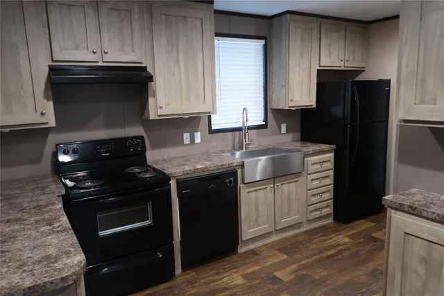 a kitchen with a sink stove and refrigerator