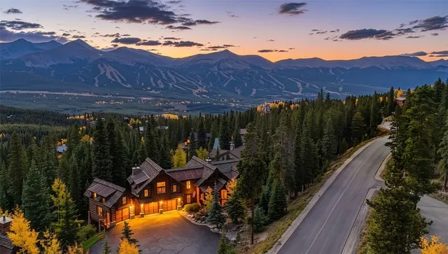 a view of a patio with a table chairs and a fire pit