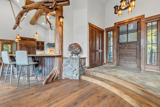 a view of a livingroom with furniture and staircase