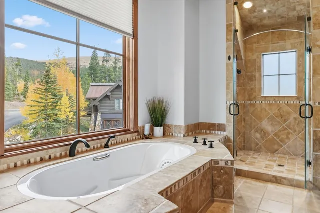 a bath tub sitting next to a window