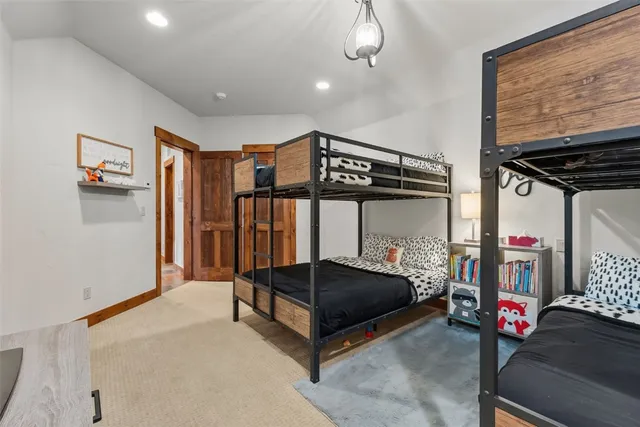 a bedroom with furniture and a chandelier