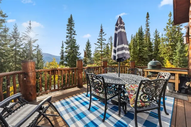 a view of a chairs and table on the deck