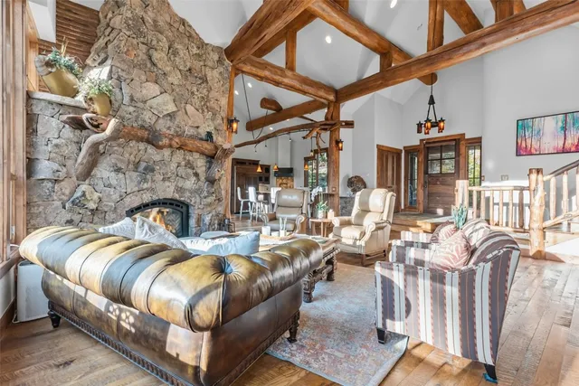 a living room with fireplace furniture and a fireplace