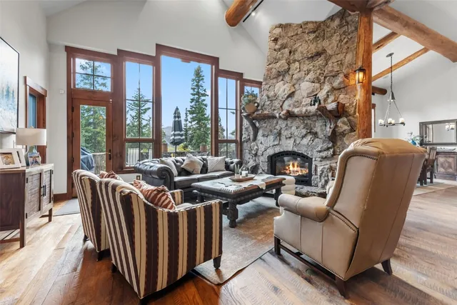 a living room with fireplace furniture and a fireplace