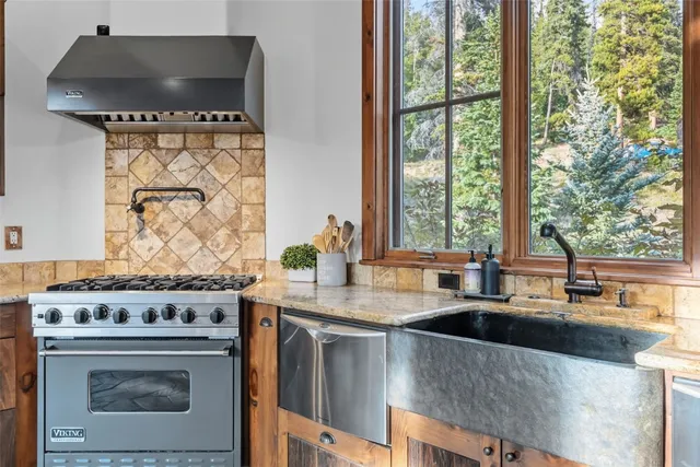 a kitchen with a stove and a sink