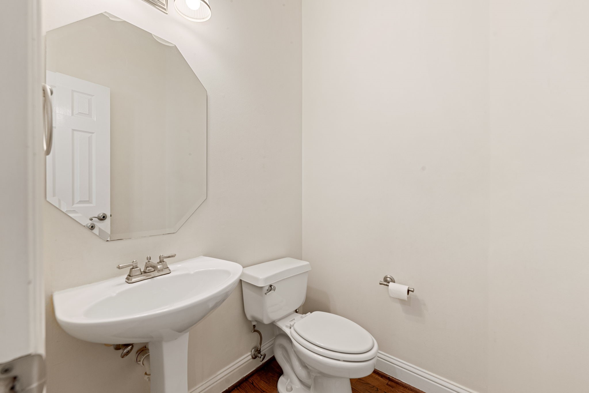 5318 Fayette Street Houston, TX 77056 - Photo 11 of 35 a bathroom with a sink a toilet and mirror