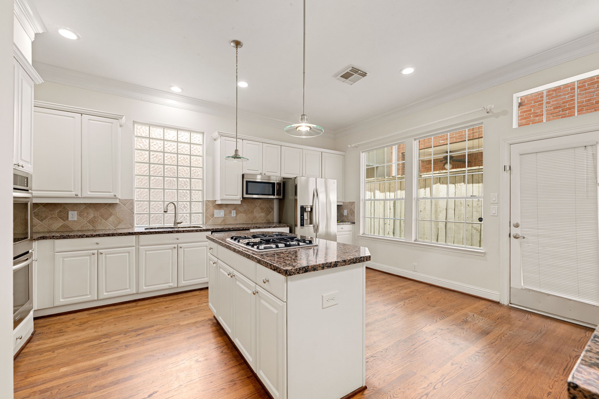 5318 Fayette Street Houston, TX 77056 - Photo 8 of 35 a kitchen with stainless steel appliances granite countertop a stove and a sink