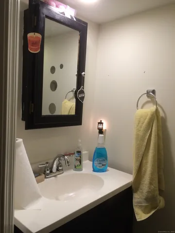 a bathroom with a sink and mirror