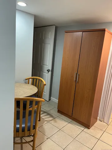 a white toilet sitting next to a small sink