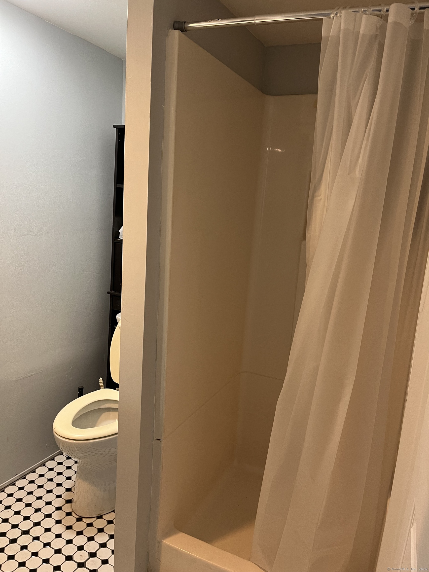 1397 State Street, Unit B2 New Haven, CT 06511 - Photo 7 of 8 a white toilet sitting next to a small sink