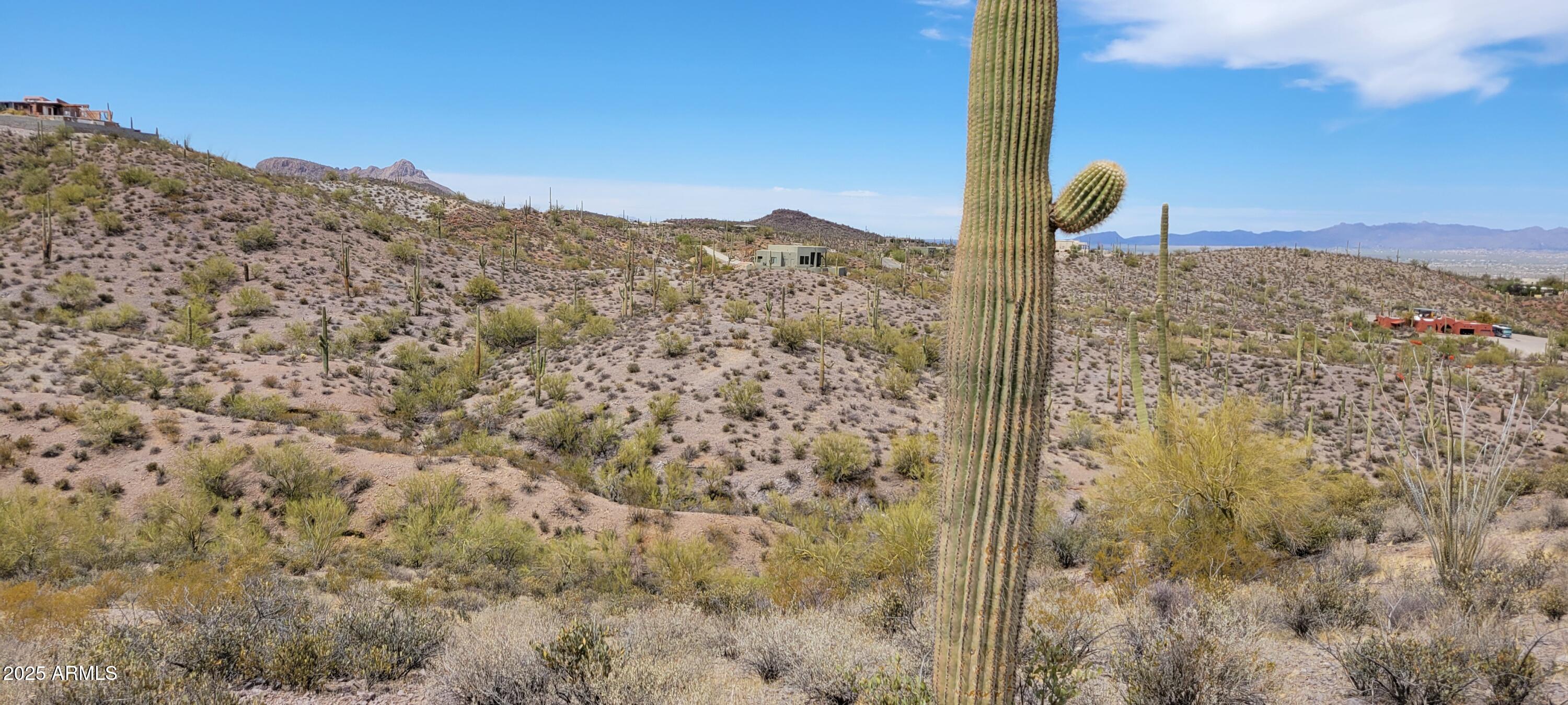 4790 North El Adobe Ranch Road Tucson, AZ 85745 - Photo 20 of 26 a view of a road with a mountain in the background