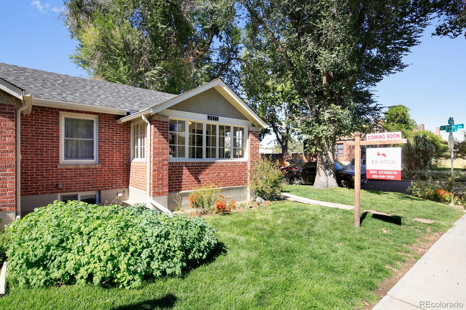 3877 Perry Street Denver, CO 80212 - Photo 1 of 23 a front view of a house with a yard