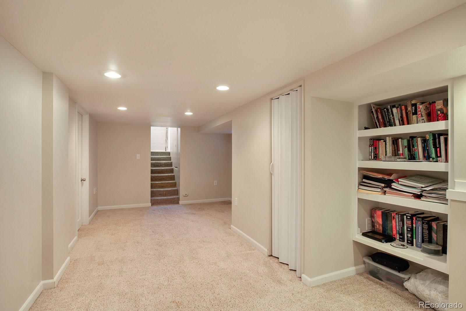 3877 Perry Street Denver, CO 80212 - Photo 16 of 23 a view of room with shelves