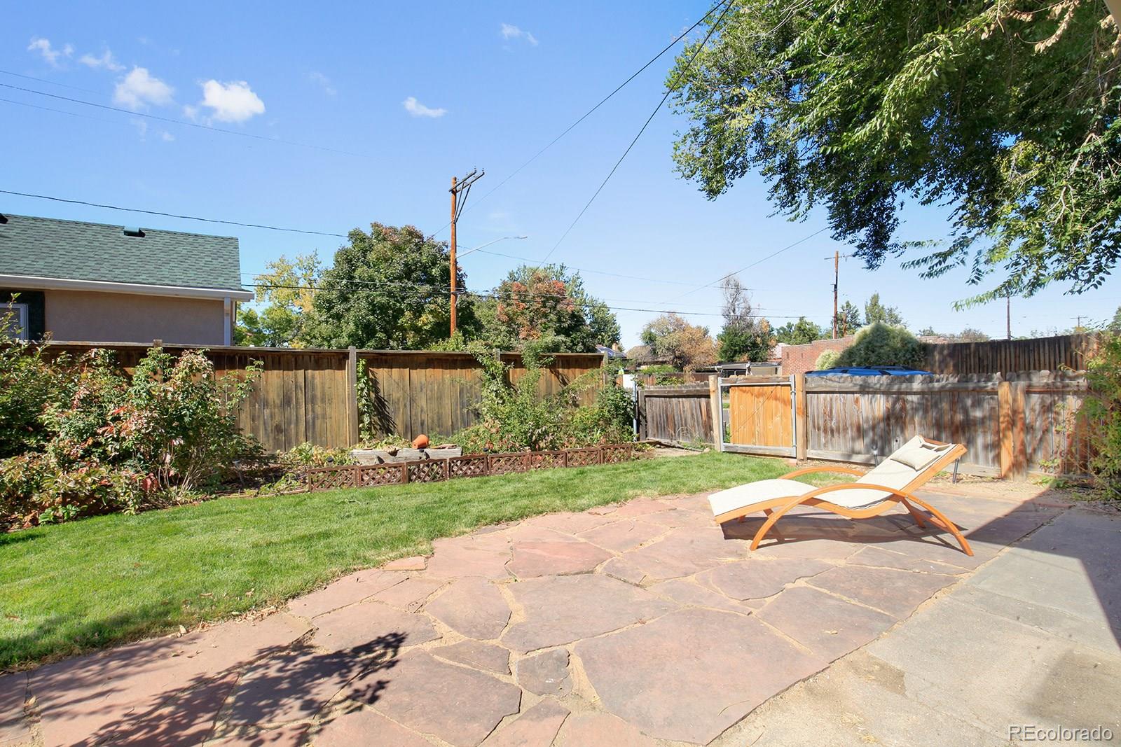 3877 Perry Street Denver, CO 80212 - Photo 19 of 23 a view of a house with backyard and sitting area