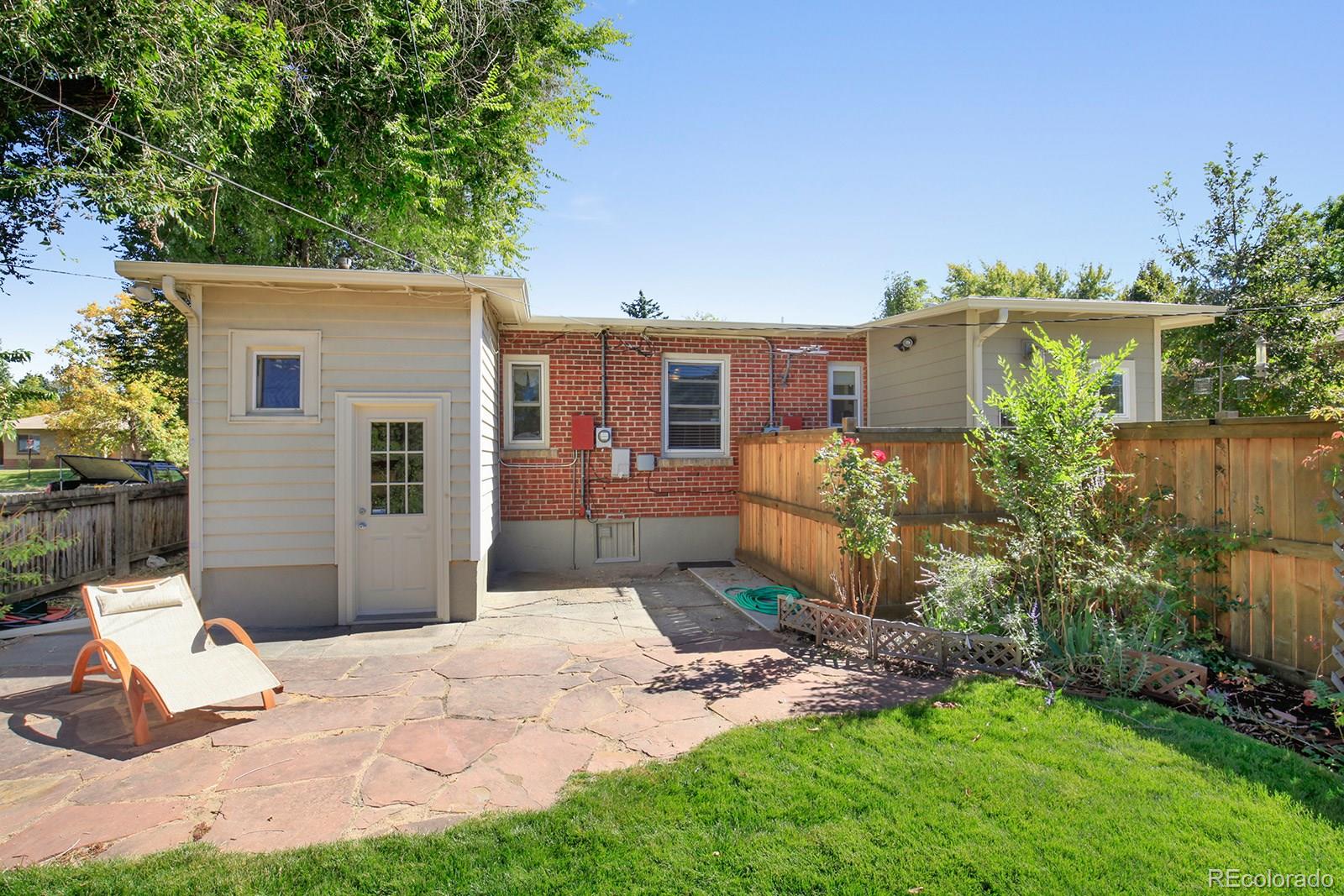 3877 Perry Street Denver, CO 80212 - Photo 23 of 23 a view of a house with backyard and sitting area