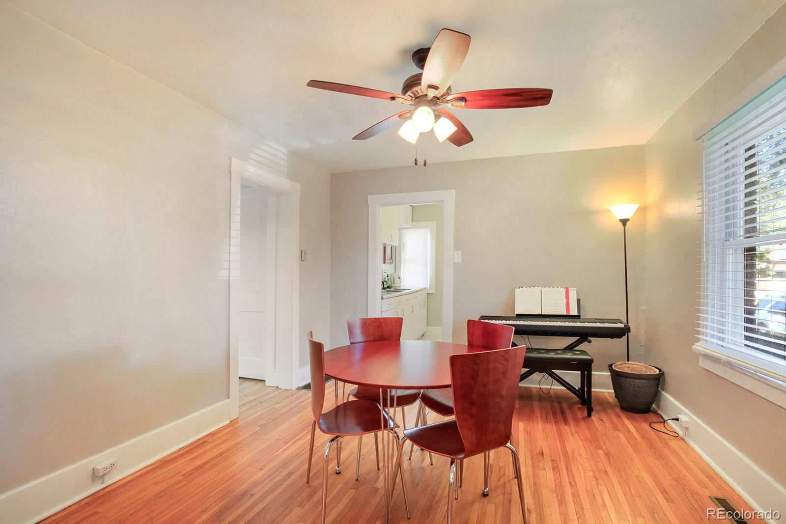 3877 Perry Street Denver, CO 80212 - Photo 6 of 23 a dining room with furniture and window
