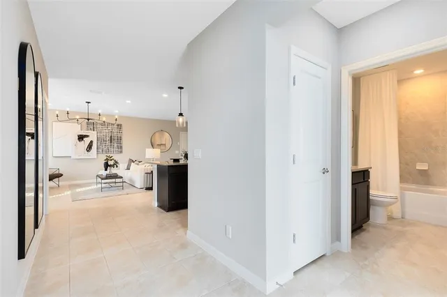 a view of a living room and bedroom with furniture