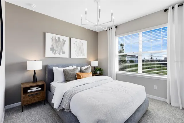 a bedroom with a bed and a mirror