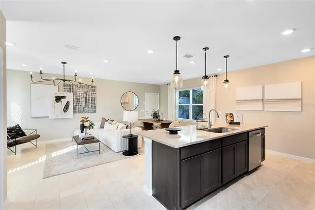 a room with a large window and chandelier