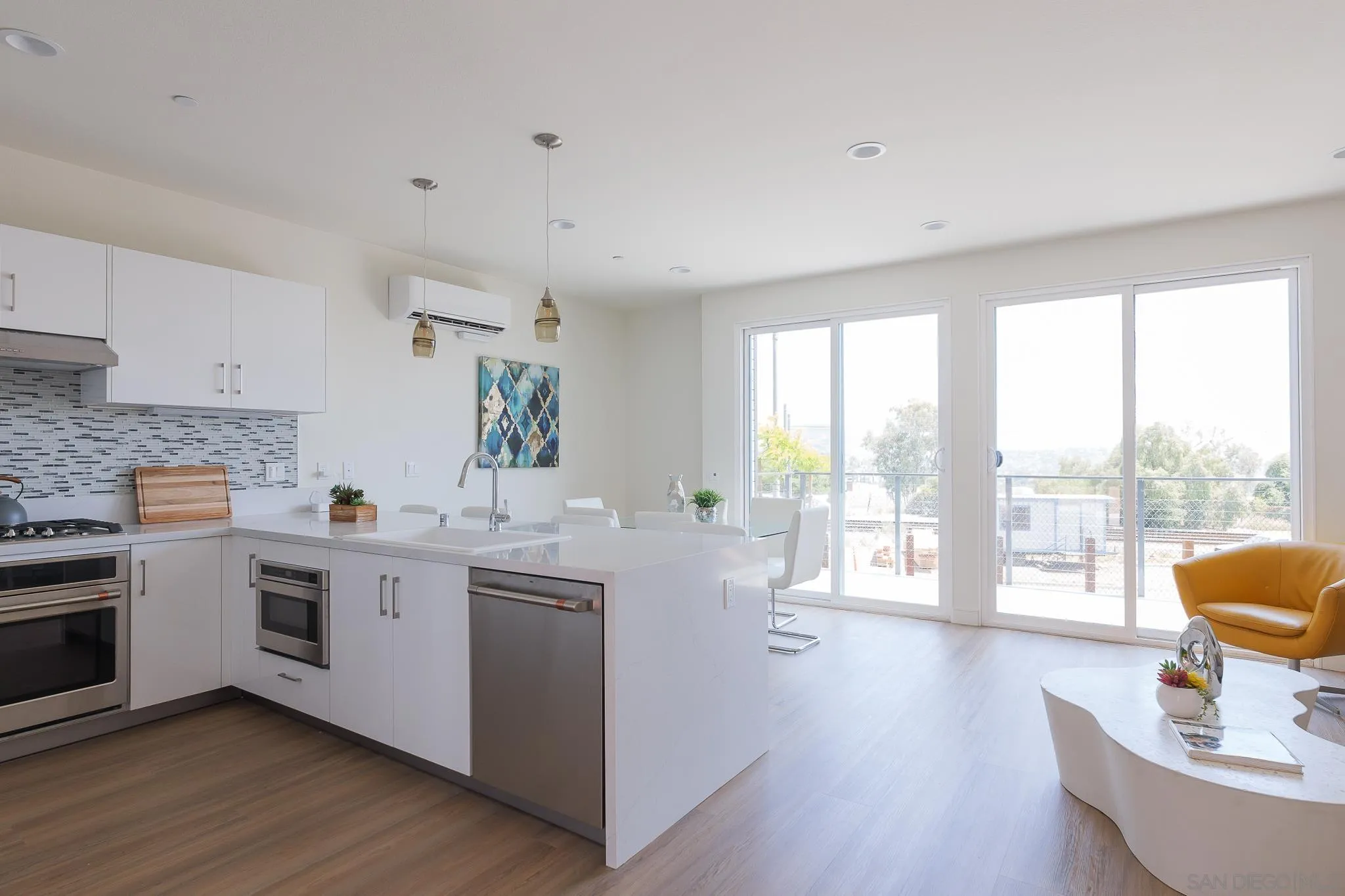 8244 High Street La Mesa, CA 91941 - Photo 2 of 27 a kitchen with a sink and wooden floor