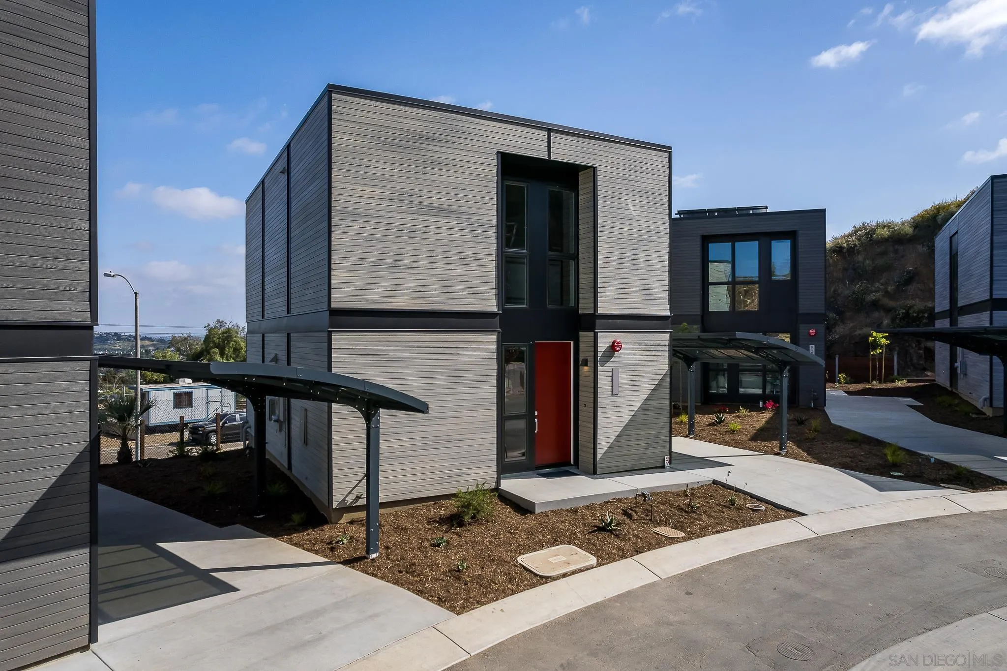 8244 High Street La Mesa, CA 91941 - Photo 22 of 27 a front view of a house with barbeque grill and seating space