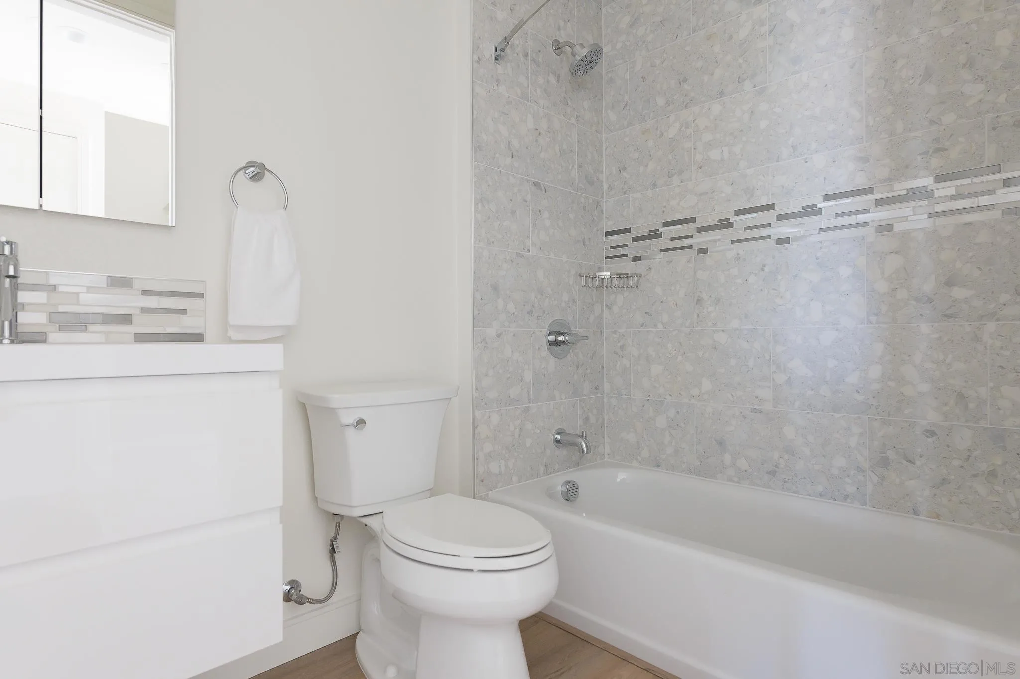8244 High Street La Mesa, CA 91941 - Photo 9 of 27 a bathroom with a sink a toilet and bathtub