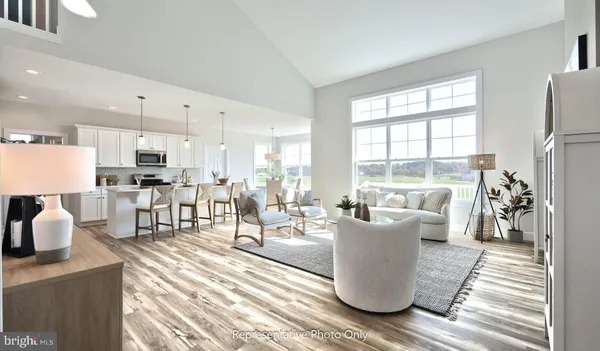 a living room with furniture and a table