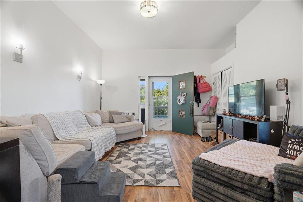 15 Division Street Pittsburgh, PA 15205 - Photo 3 of 44 a living room with furniture a flat screen tv and a table