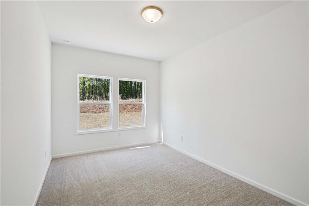 240 Silverleaf Trail Bethlehem, GA 30620 - Photo 11 of 39 an empty room with a window