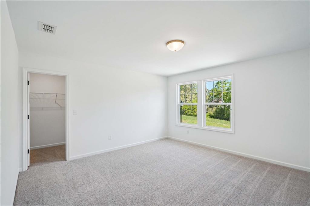 240 Silverleaf Trail Bethlehem, GA 30620 - Photo 14 of 39 a view of an empty room with a window