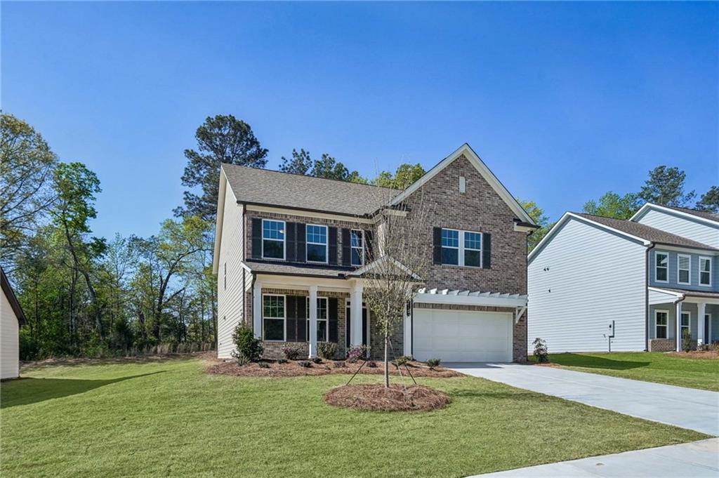 240 Silverleaf Trail Bethlehem, GA 30620 - Photo 2 of 39 a front view of a house with a yard