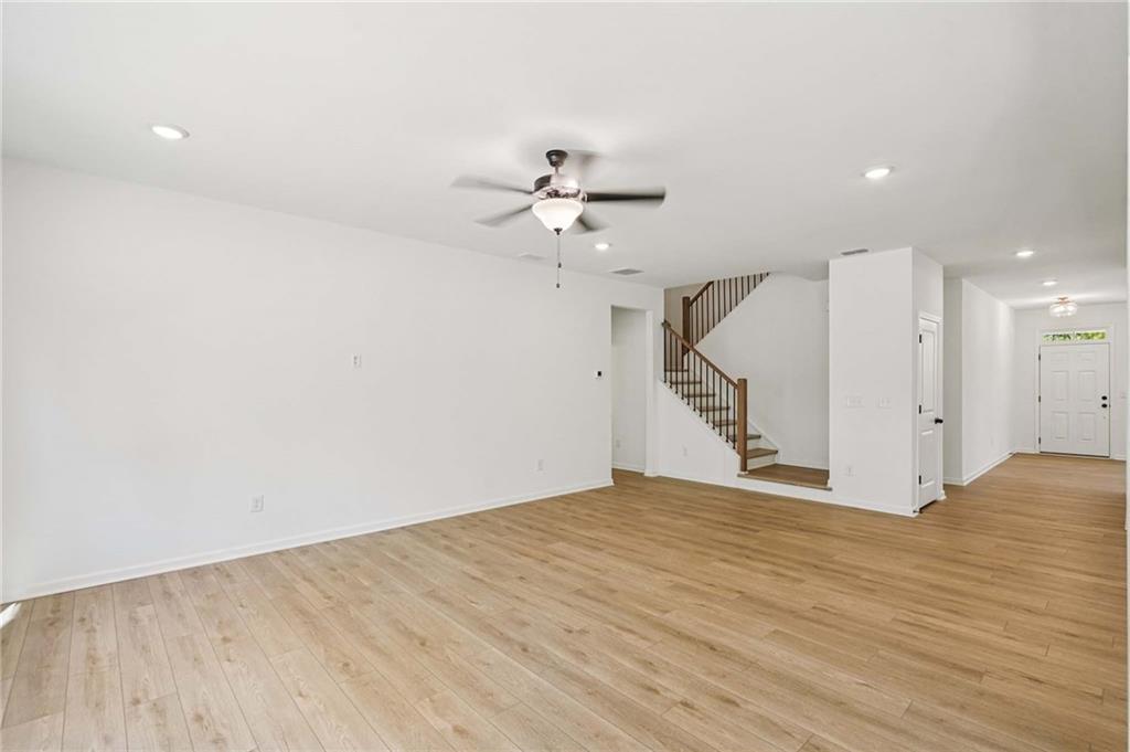 240 Silverleaf Trail Bethlehem, GA 30620 - Photo 3 of 39 wooden floor in a room with a ceiling fan