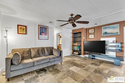 a lobby with furniture and a potted plant