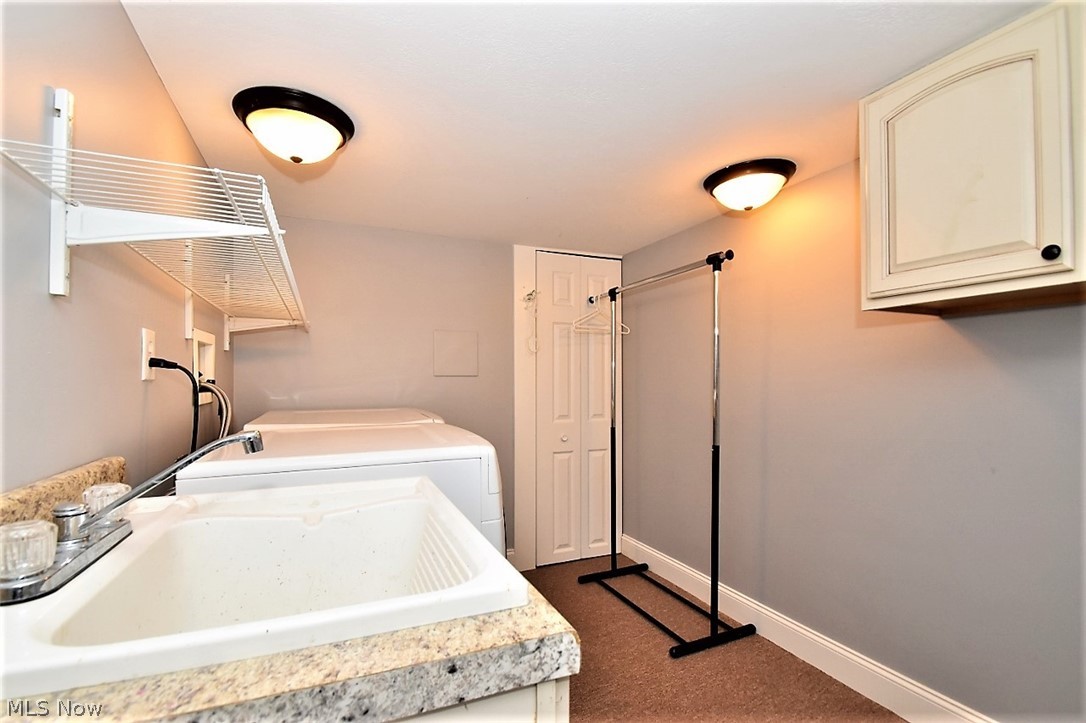 3309 Stockholm Road Cleveland, OH 44120 - Photo 30 of 35 Laundry room complete with storage and laundry sink