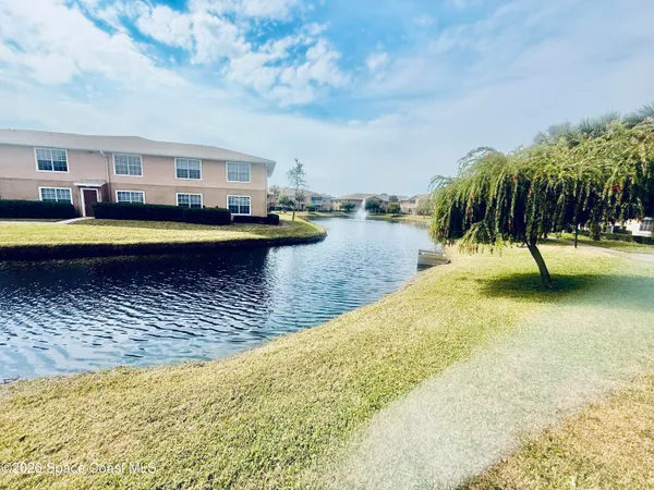 a view of swimming pool with outdoor seating and yard