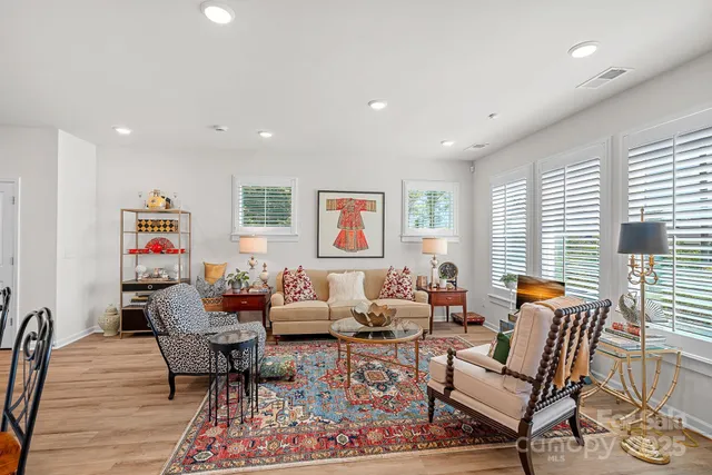a living room with furniture and a rug