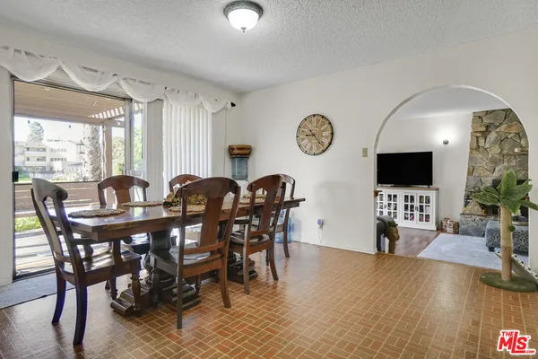 a view of a dining room with furniture and window