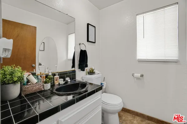 a bathroom with a sink and a toilet