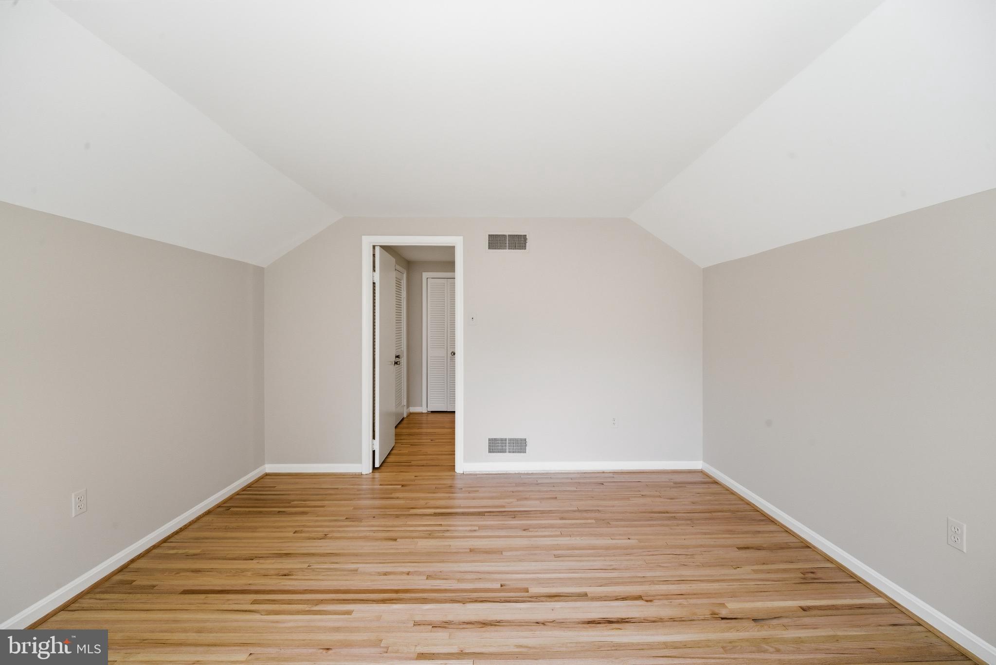 13309 Old Forge Road Silver Spring, MD 20904 - Photo 34 of 52 a view of empty room with wooden floor
