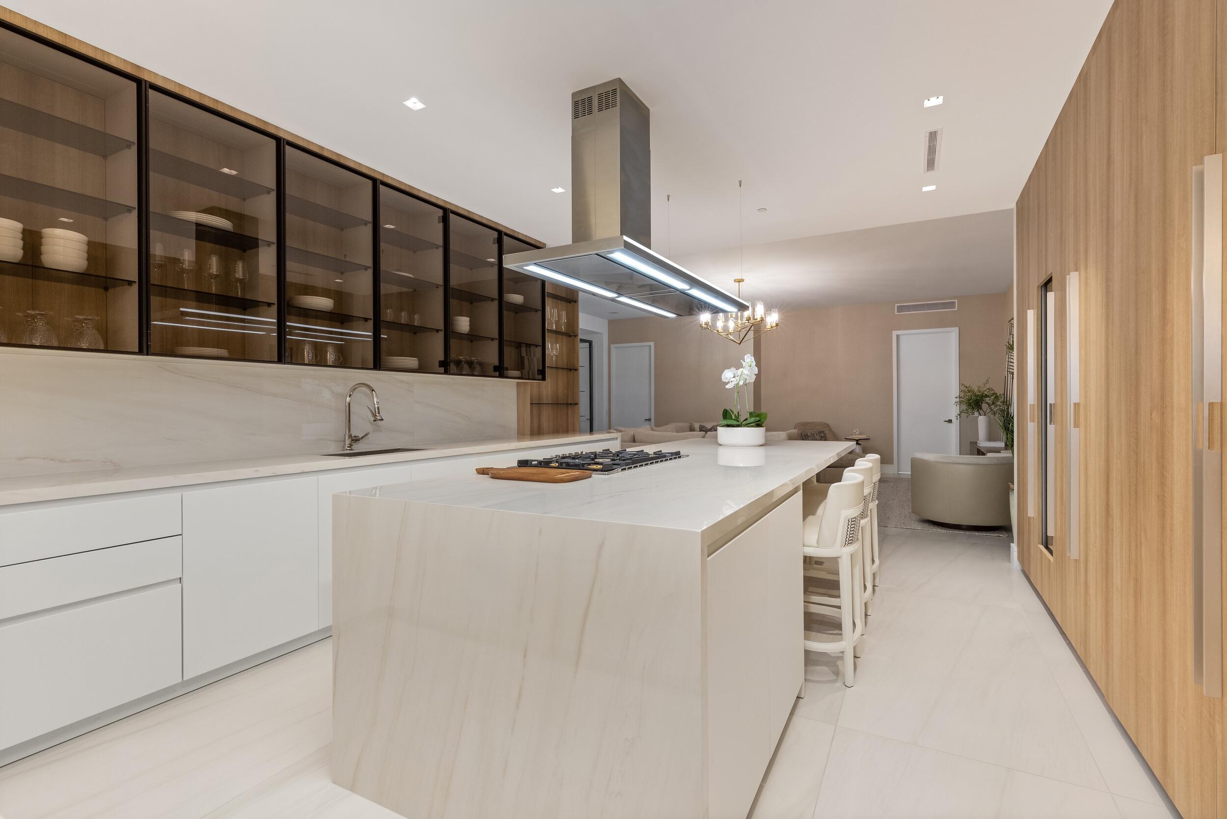 725 South Ocean Boulevard, Unit 402 Boca Raton, FL 33432 - Photo 11 of 41 a kitchen with a sink a stove and a refrigerator
