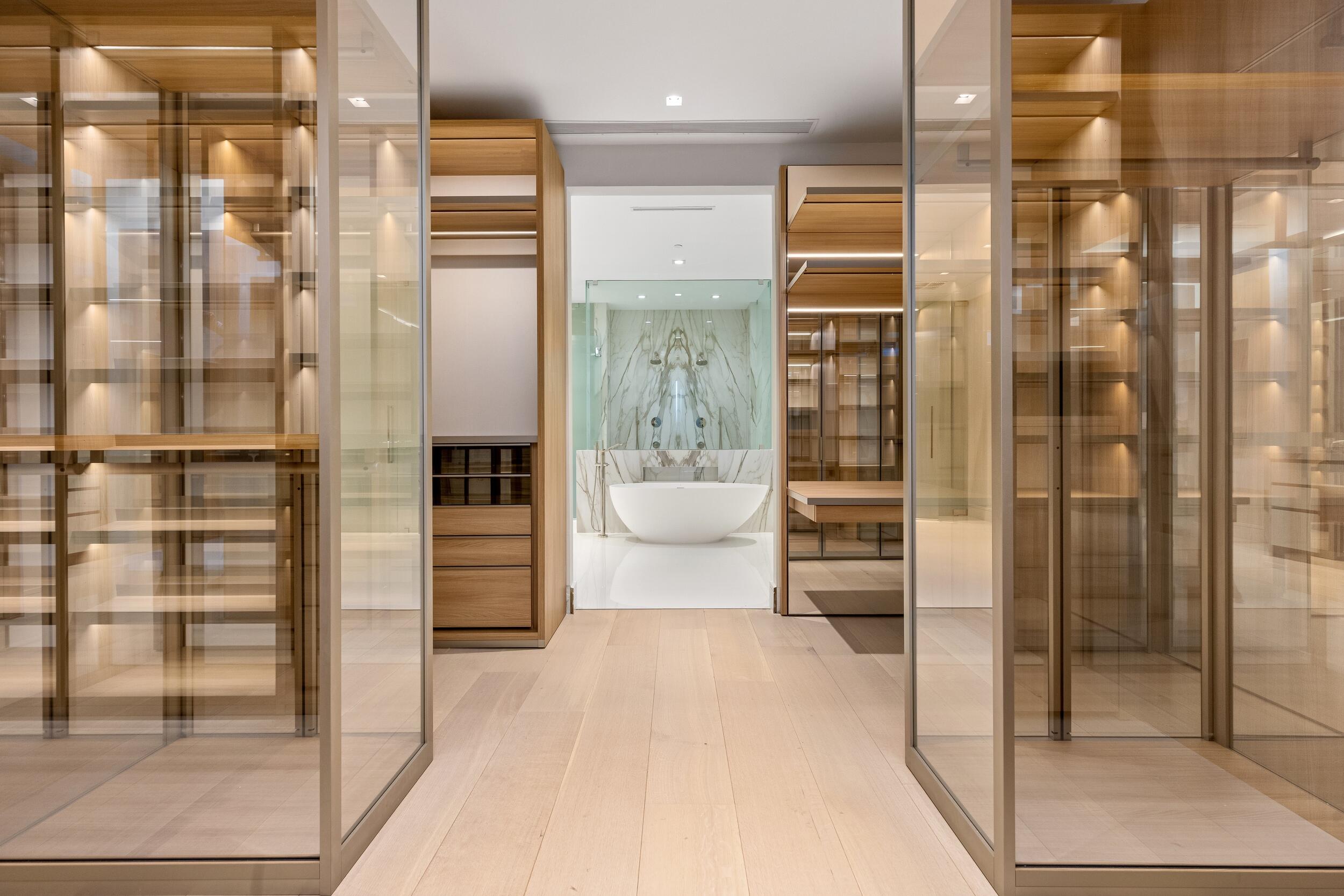 725 South Ocean Boulevard, Unit 402 Boca Raton, FL 33432 - Photo 16 of 41 a bathroom with a double vanity sink and a shower