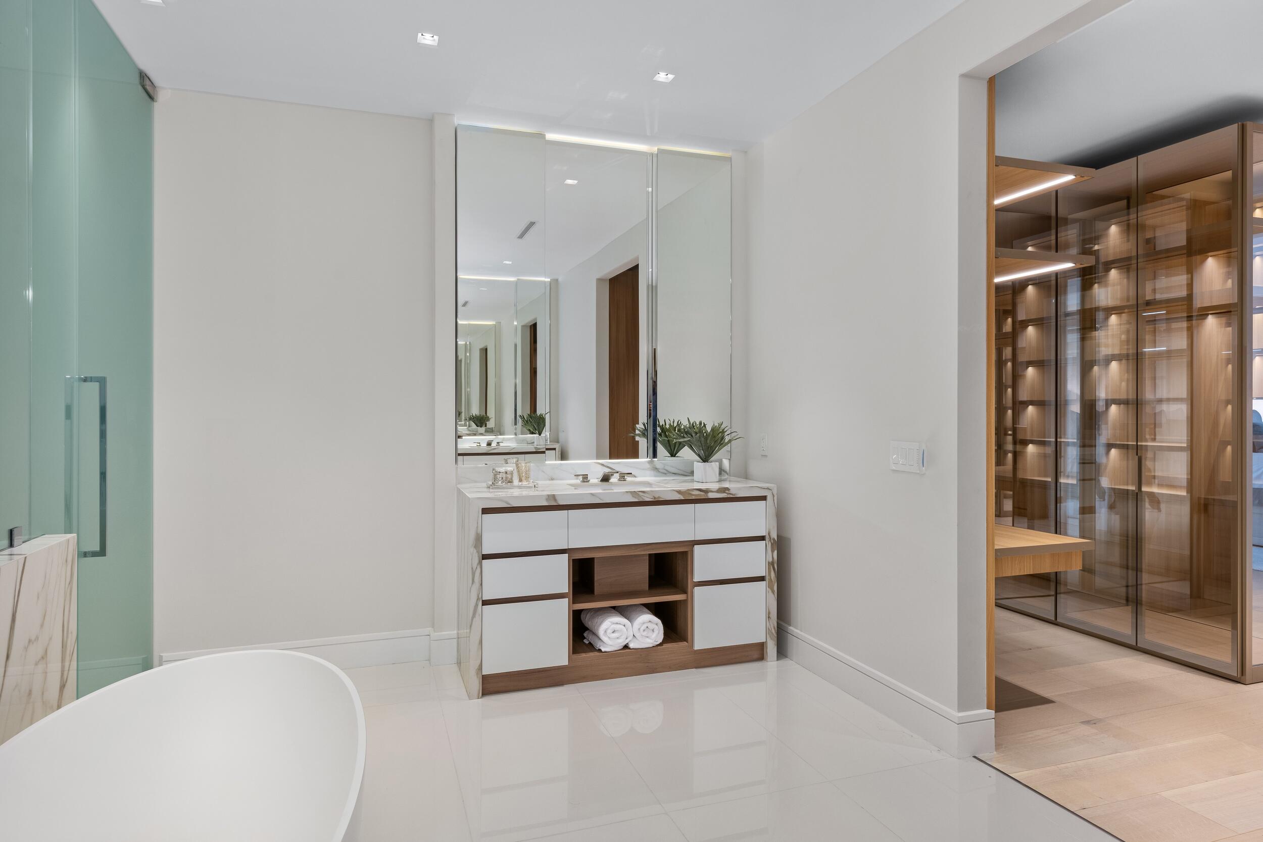 725 South Ocean Boulevard, Unit 402 Boca Raton, FL 33432 - Photo 19 of 41 a bathroom with a sink a toilet and shower