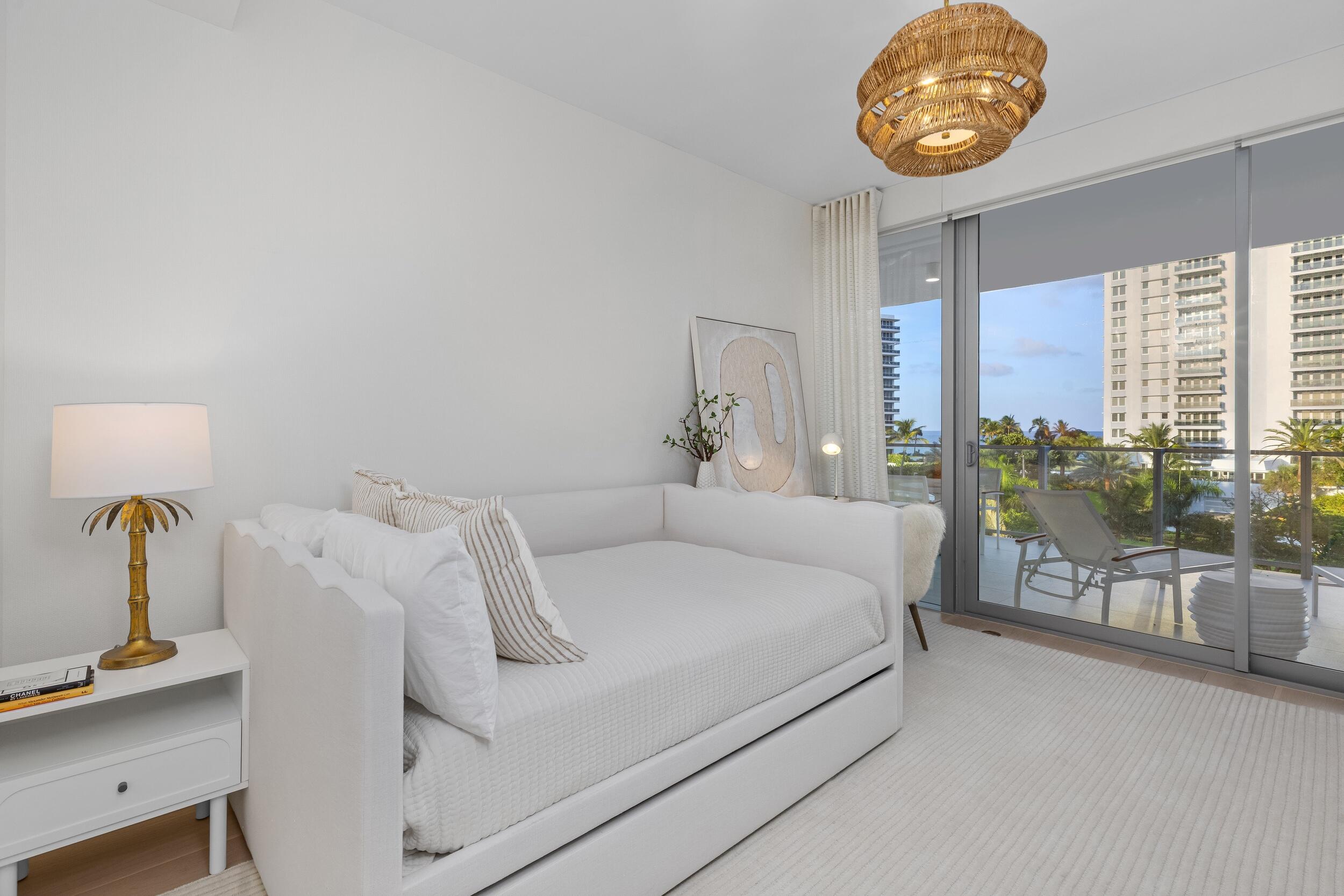 725 South Ocean Boulevard, Unit 402 Boca Raton, FL 33432 - Photo 25 of 41 a bedroom with a bed and a window