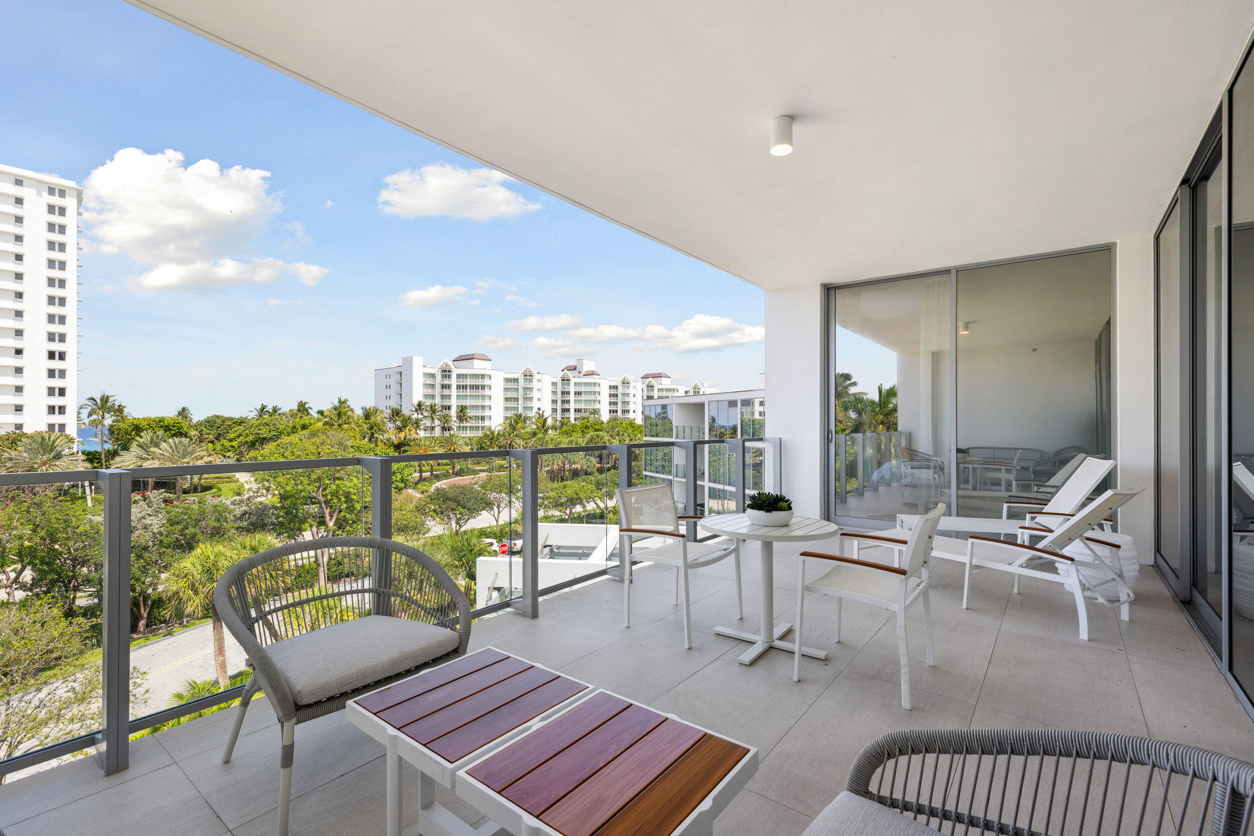 725 South Ocean Boulevard, Unit 402 Boca Raton, FL 33432 - Photo 26 of 41 a living room with furniture city view and large windows