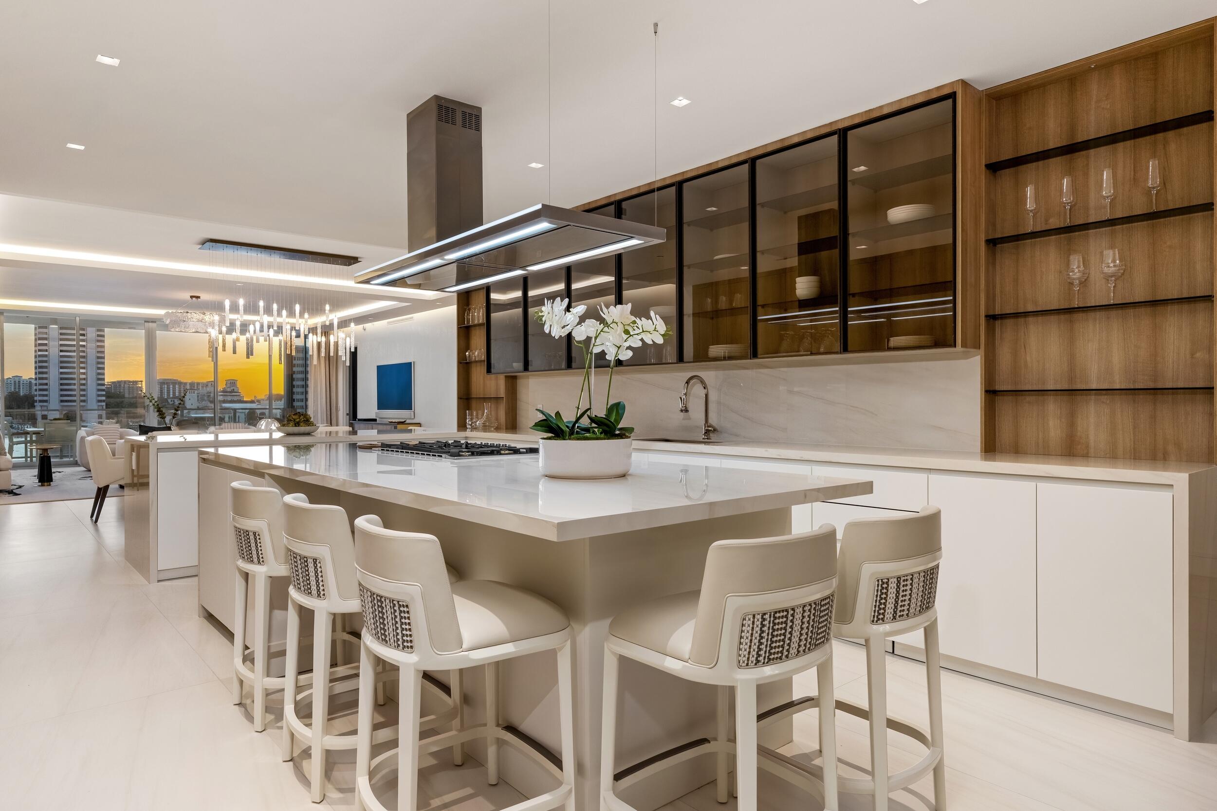 725 South Ocean Boulevard, Unit 402 Boca Raton, FL 33432 - Photo 28 of 41 a kitchen with stainless steel appliances a sink and cabinets