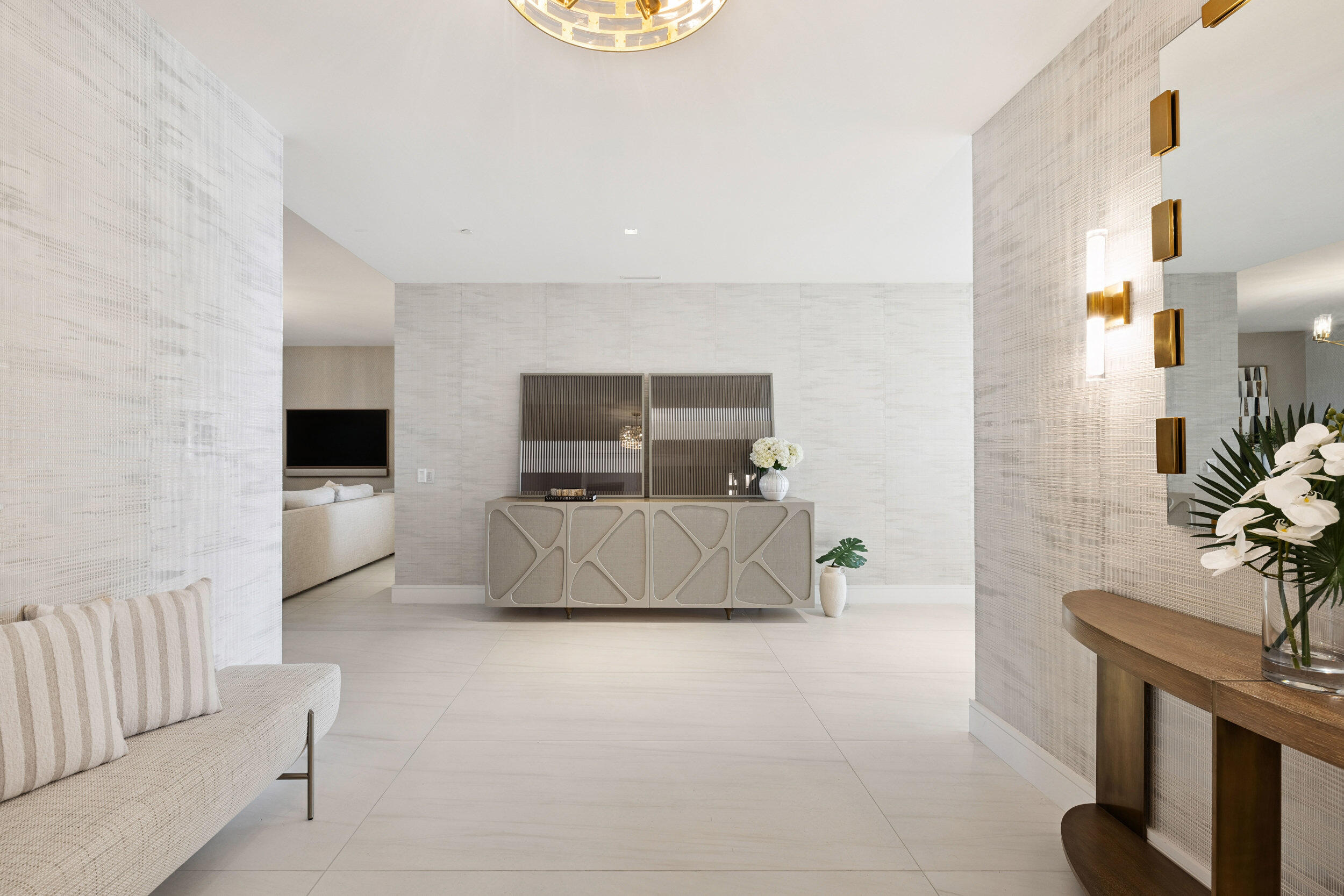 725 South Ocean Boulevard, Unit 402 Boca Raton, FL 33432 - Photo 3 of 41 a living room with furniture and a flat screen tv