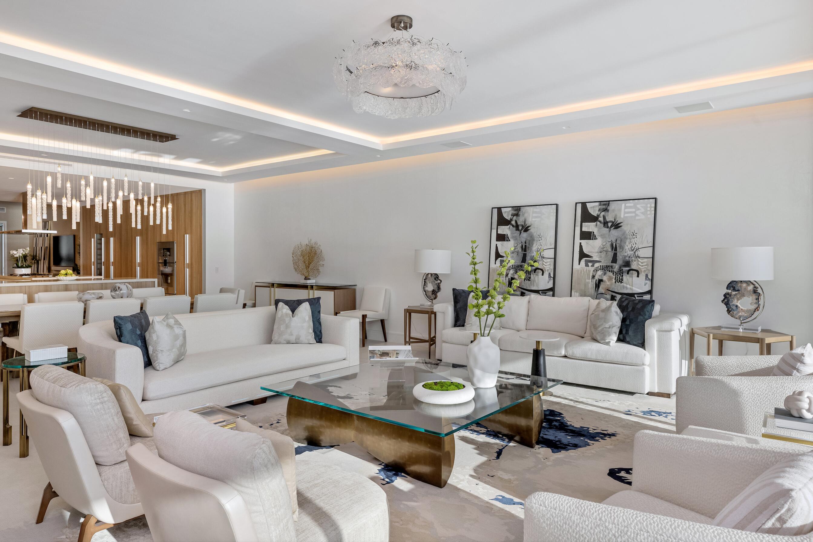 725 South Ocean Boulevard, Unit 402 Boca Raton, FL 33432 - Photo 8 of 41 a living room with furniture and a chandelier