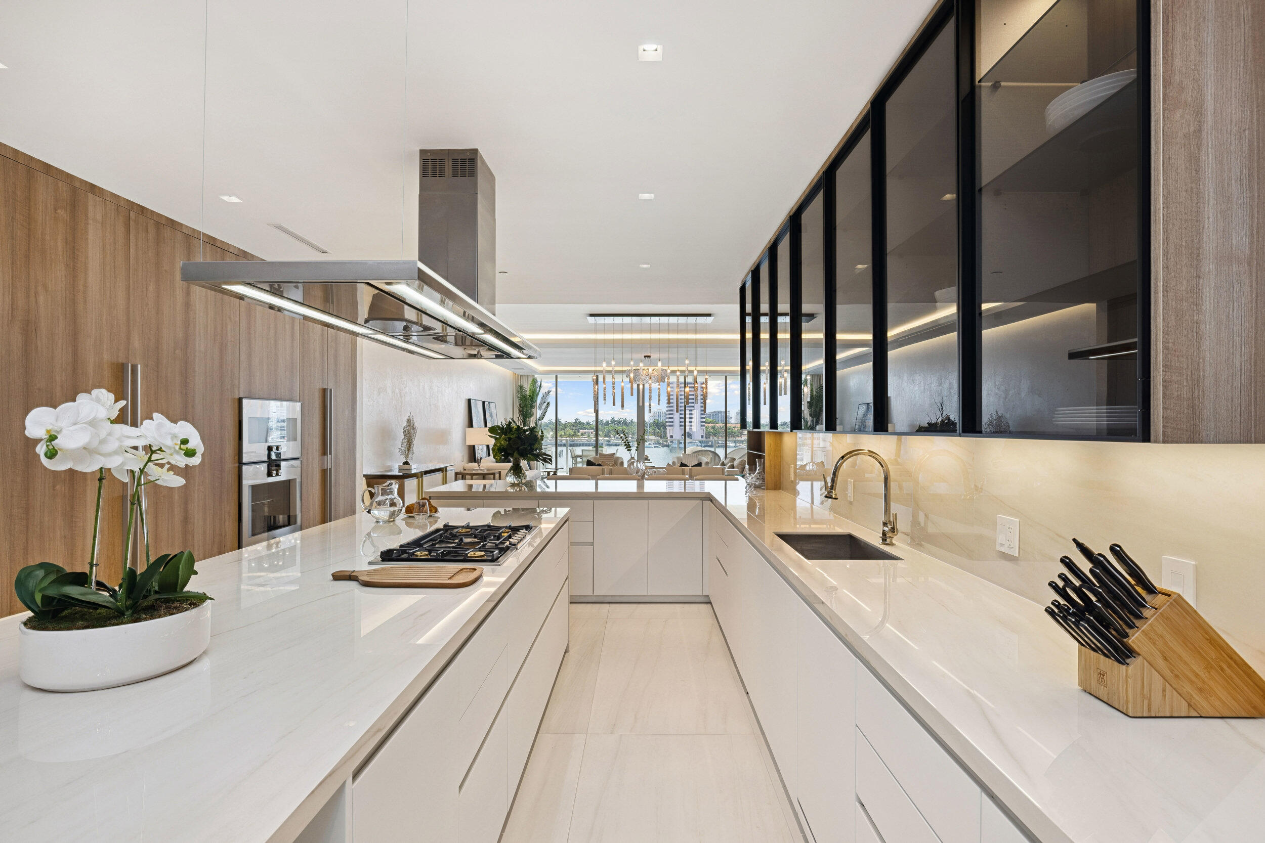 725 South Ocean Boulevard, Unit 402 Boca Raton, FL 33432 - Photo 9 of 41 a view of living room with furniture and a chandelier