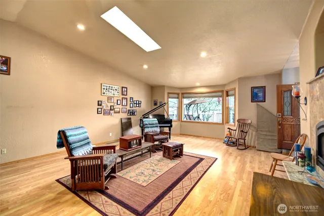 a view of a workspace with furniture and a flat screen tv