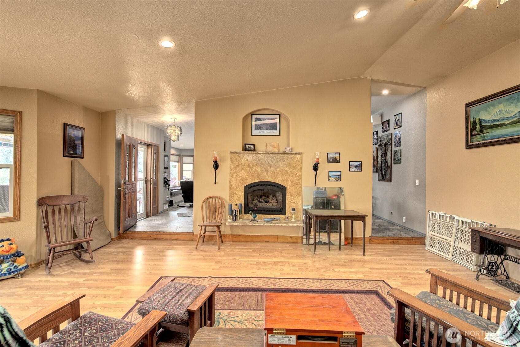 15714 Forty Five Road Arlington, WA 98223 - Photo 14 of 40 a living room with furniture a fireplace and a flat screen tv